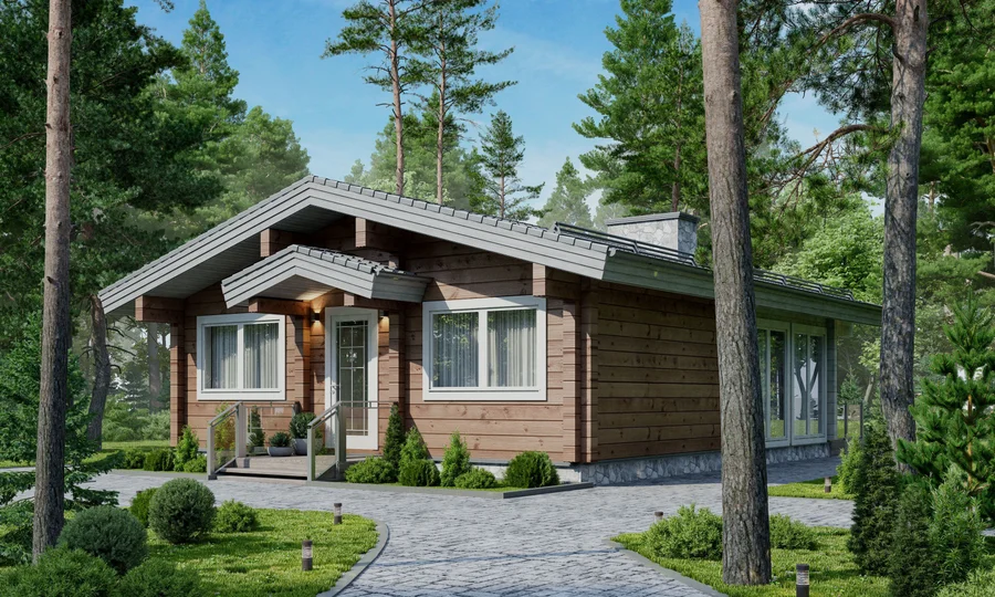 A charming wooden cabin with a gray roof surrounded by lush green trees and a paved pathway.